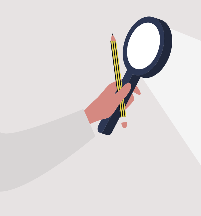 Hand holding a magnifying glass and pencil